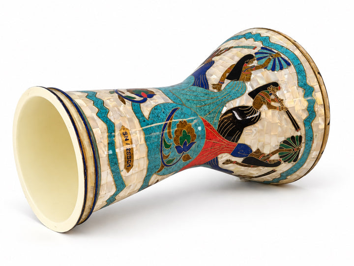 Sala Nile Muse Sombaty darbuka on its side, showing the open base and Egyptian-inspired figures, turquoise borders and colorful floral scrolls.